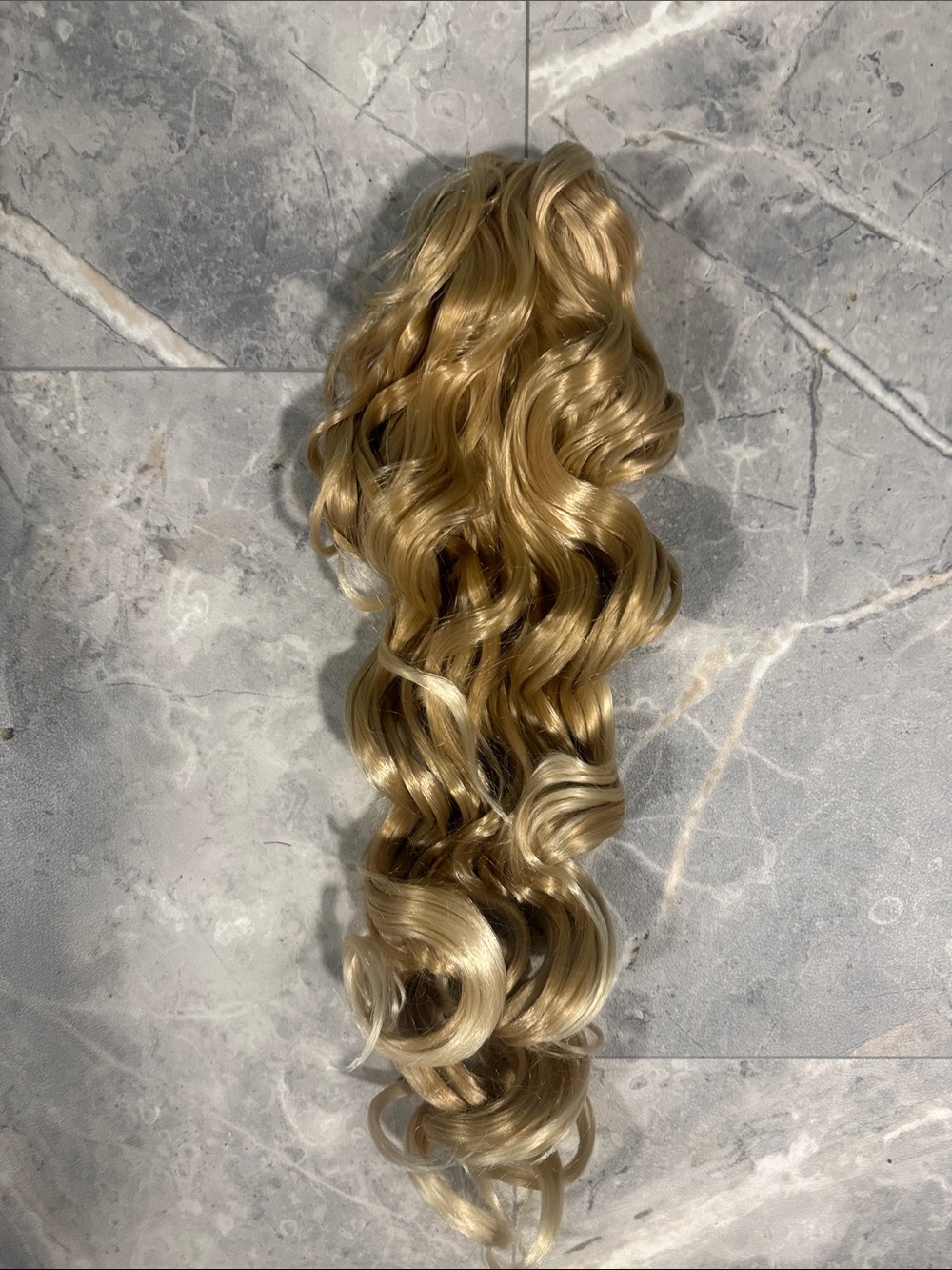 2/$30. 22” Synthetic Blonde Curly Clip-In Ponytail Extension